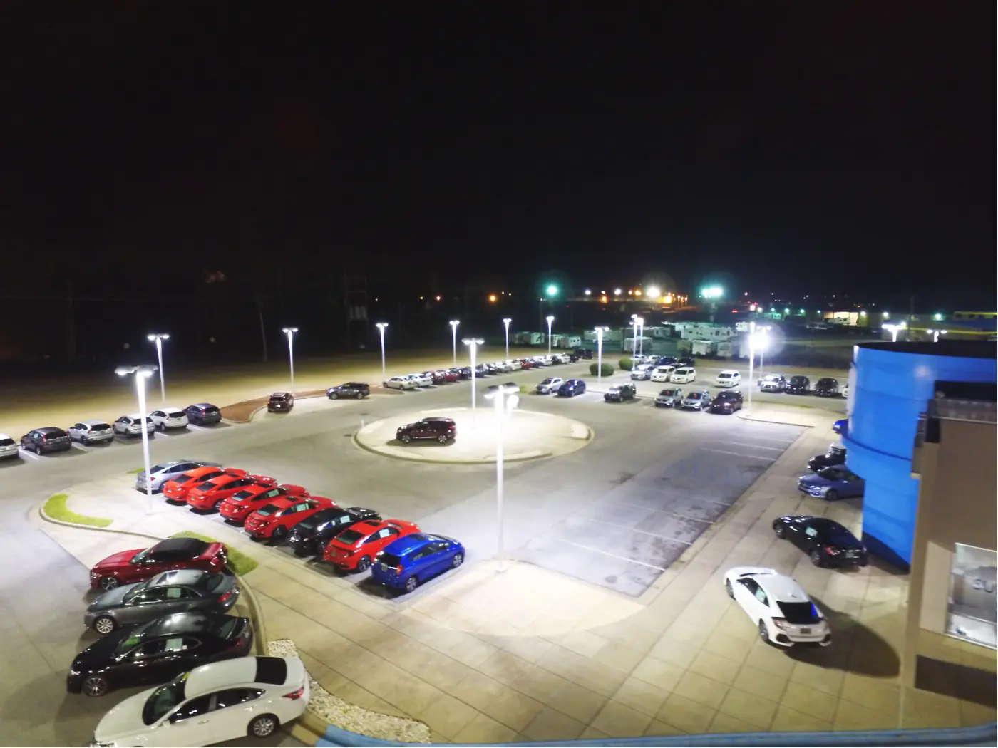 Auto dealership lot lit with DM300 retrofits at night
