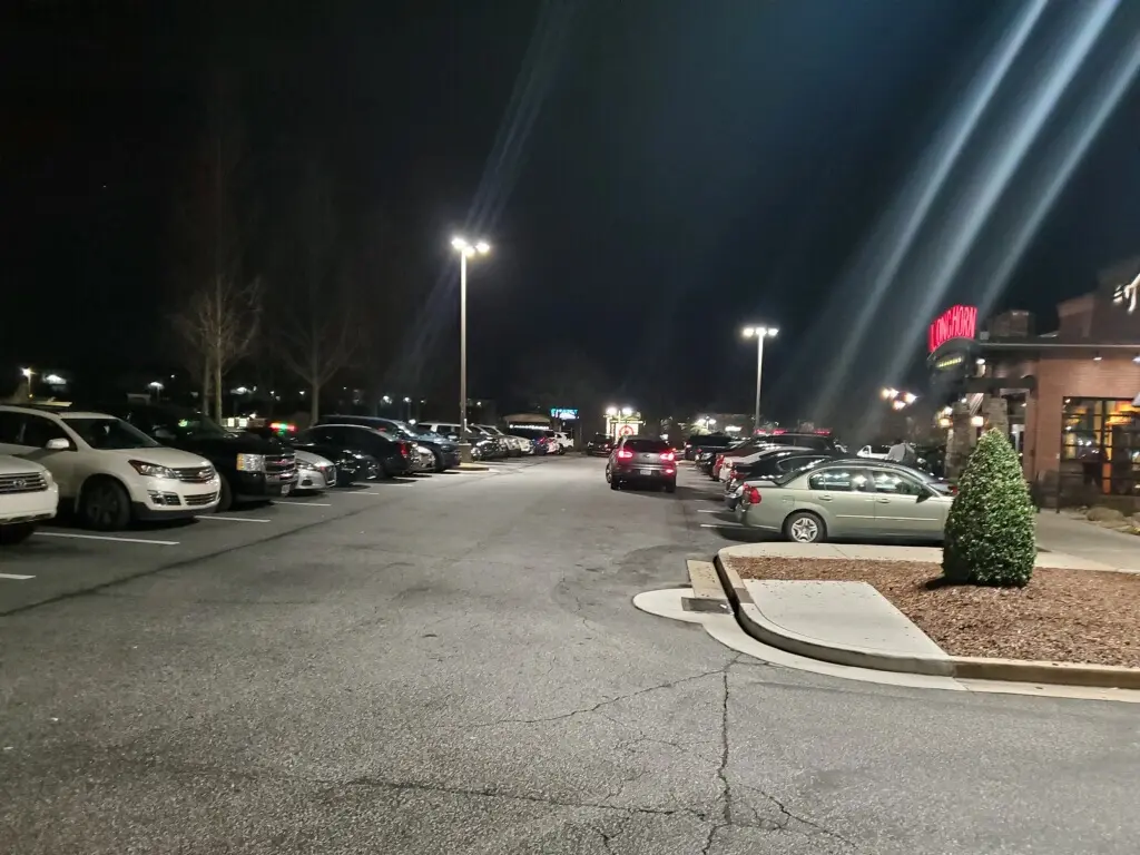 Restaurant parking lot, Atlanta area — same poles, same housings, DM(Z) inside after