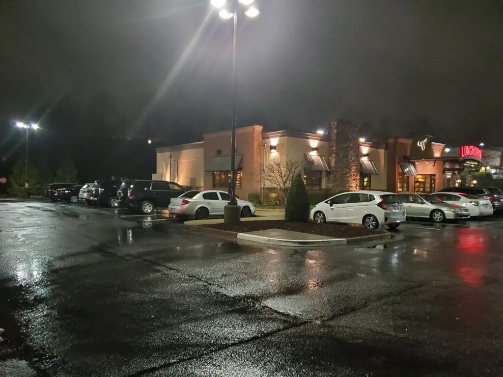 Restaurant parking lot, Atlanta area — same poles, same housings, DM(Z) inside before